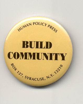 Yellow pin-button with a that reads "Build Community" and the Human Policy Press address in black